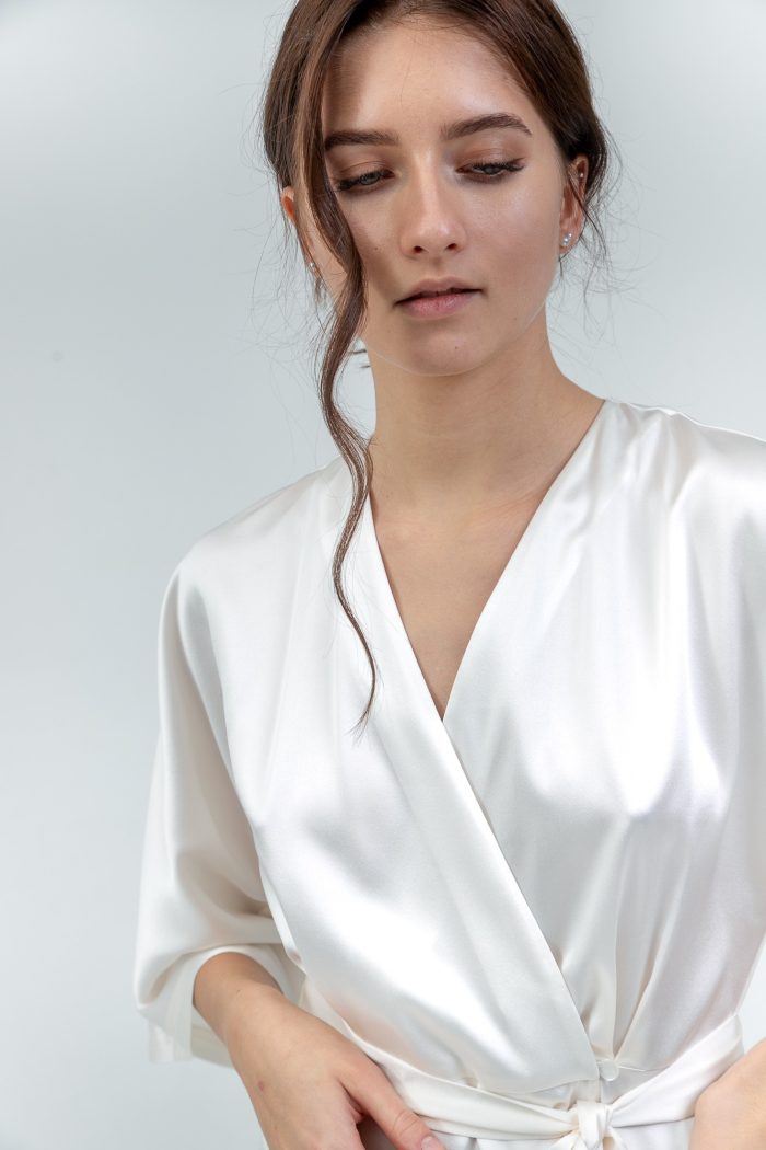 Kimono Sleeve Silk Satin Wrap Midi Dress In White closeup view Kimono Sleeve Silk Satin Wrap Midi Dress In White closeup view