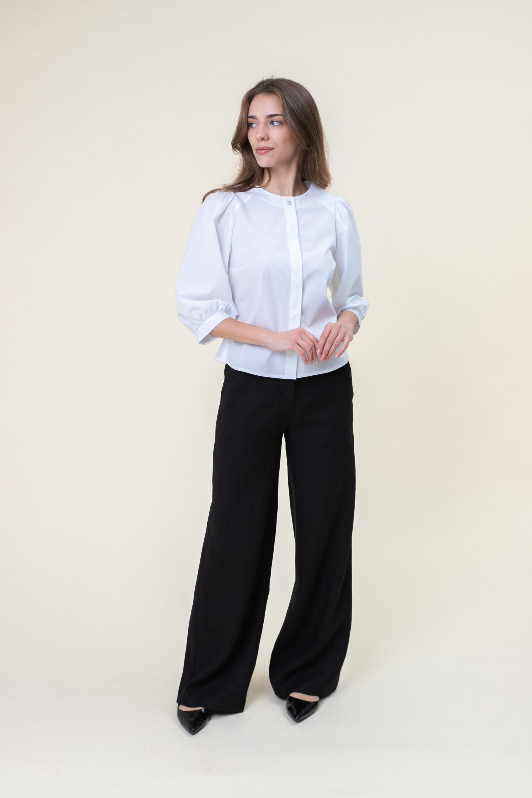 Cotton Poplin Puff Sleeve Blouse In White front view hand in hand.jpg