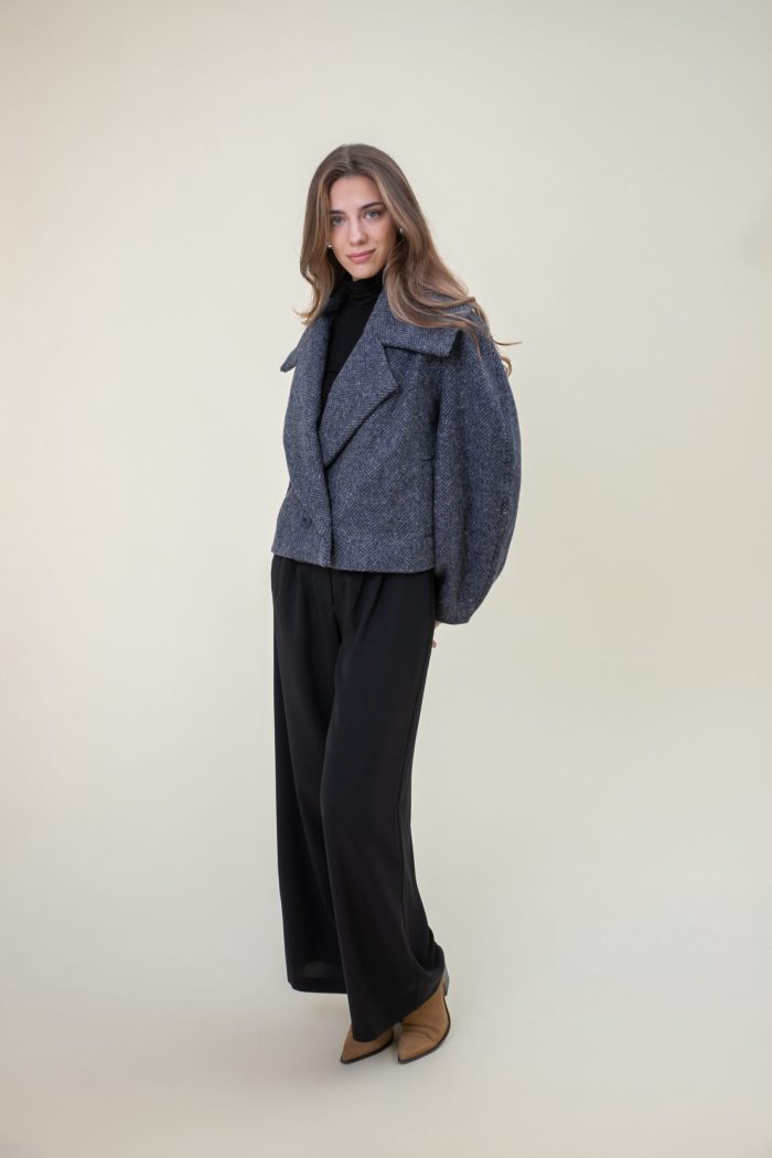 Double Breasted Wool Jacket In Herringbone side front view Double Breasted Wool Jacket In Herringbone side front view
